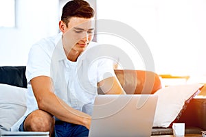 Man working on laptop at home