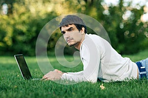 Man working with laptop outdoors