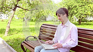 Man working with laptop in park