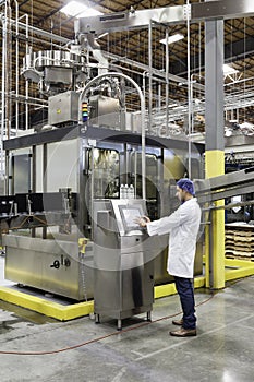 Man working on machinery in bottling industry