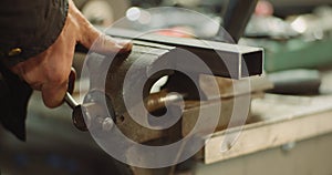 Man Working at Metal Industry - Cutting and Measuring Metal Parts at Workshop