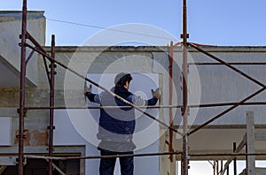 Man working with meter at thermal insulation