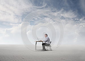 Man working in the middle of a desert