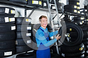 man working with new tyre