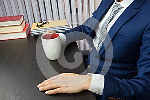 Man working in office, computer and coffee