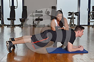 Man working out with his pesonal trainer