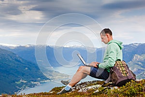 Man working outdoors with laptop