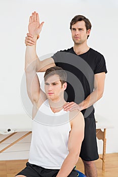 Man working with a physical therapist