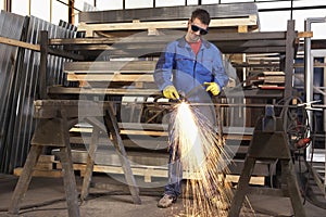 Man working with plasma cutter