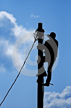 Man working on pole photo