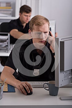 Man working on police helpline photo