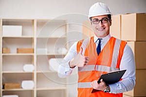 The man working in postal parcel delivery service office