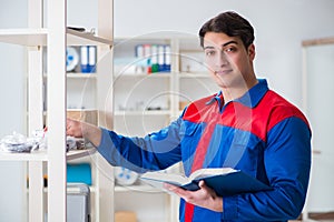 The man working in the postal warehouse