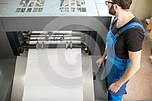 Man working at the printing manufacturing