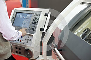 Man working at programmable machine