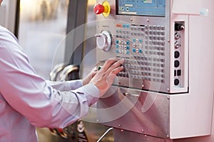 Man working at programmable machine