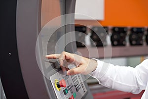 Man working at programmable machine photo