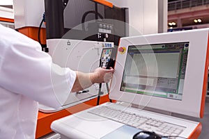 Man working at programmable machine