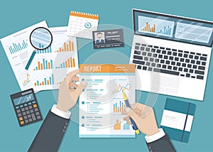 Man working with a report. Businessman hands with paper documents, forms, calendar, laptop, calculator.