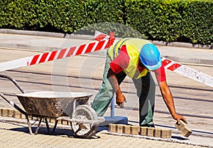 Man is working at the road construction