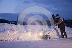 Man working with snow plough photo