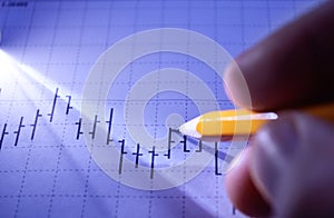 Man working on a statistical graph photo