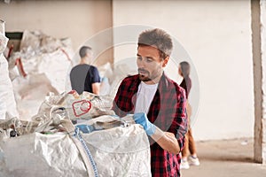 Man working at the waste recycling plant