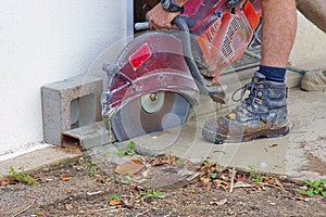 A man working with a wet saw