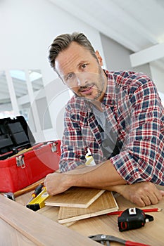 Man working on wood planks DIY at home