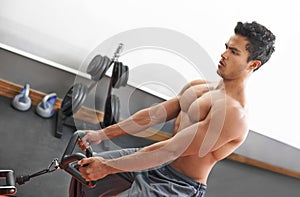 Man, workout and cable exercise for arms in gym or muscle performance or bodybuilder training, fitness or strong. Male