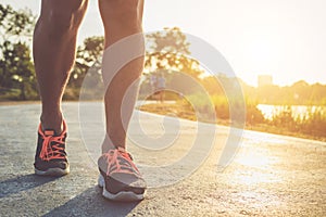 Man workout wellness concept : Runner feet with sneaker shoe run