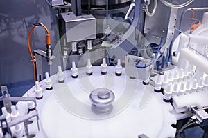The production line of the medicine. Filling interferon in bottl photo