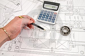 Man works with the technical drawing