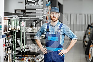 Man in workwear in the building supermarket