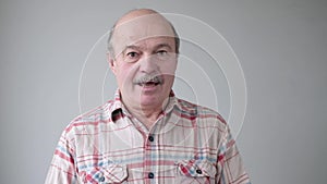 Man with worried expression listening news about his health test.