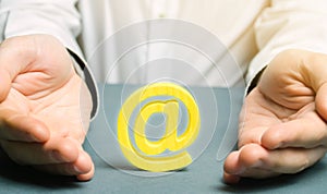 A man wraps his hands around an email symbol. Keeping the Internet open and independent from censorship, providing access