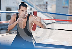 Man, wrestler and fight with in ring training on rooftop with for sport competition in outdoor. Athlete, fitness and