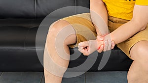 A man with a wrist injury and sits on a Chopa.