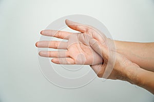 Man with wrist pain from using computer on white background, health care and medical concept,Office syndrome hand pain by