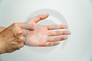 Man with wrist pain from using computer on white background, health care and medical concept,Office syndrome hand pain by