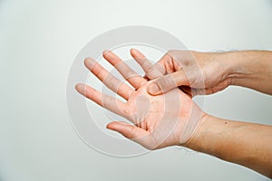 Man with wrist pain from using computer on white background, health care and medical concept,Office syndrome hand pain by