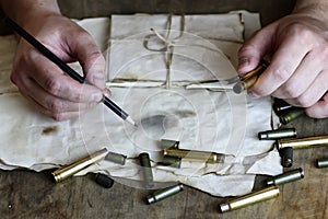 Man write letter retro bullet on the table