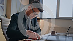 Man writer typing laptop keyboard sitting home office closeup. Guy writing notes