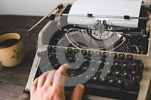 Man Writer Typing On A Old Typewriter. Journalism Report Concept