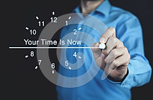 Man writes Your Time Is Now text on screen.
