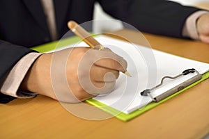 Man Writing On Blank Paper