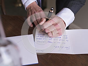 Man writing card photo