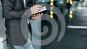 Man writing info notebook records data analysis