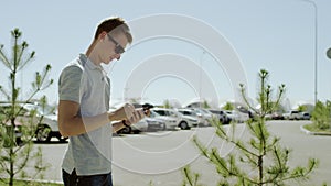 Man writing a message with a phone