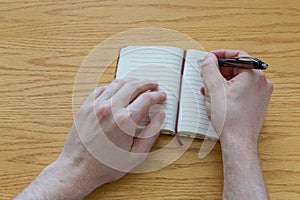 Man writing in a notebook